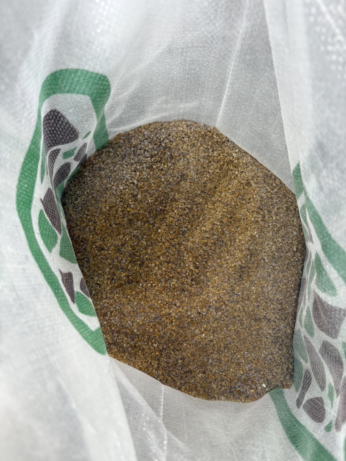 Close view of amber PebblePure glass filtration media