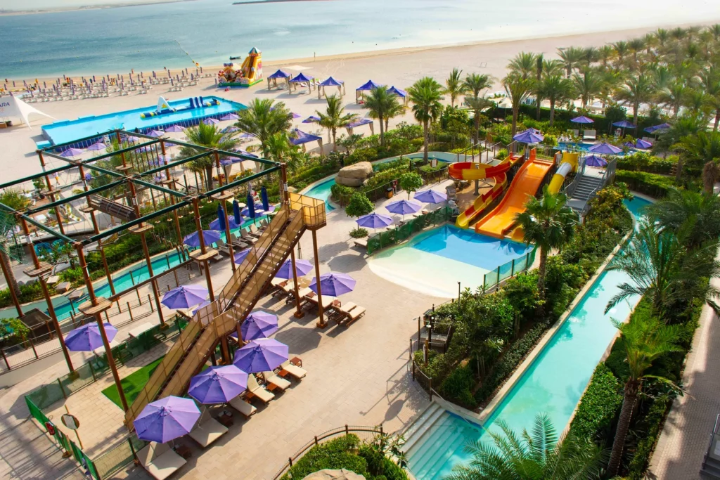 Centara Mirage Beach Resort Dubai — pool and material details — view 1