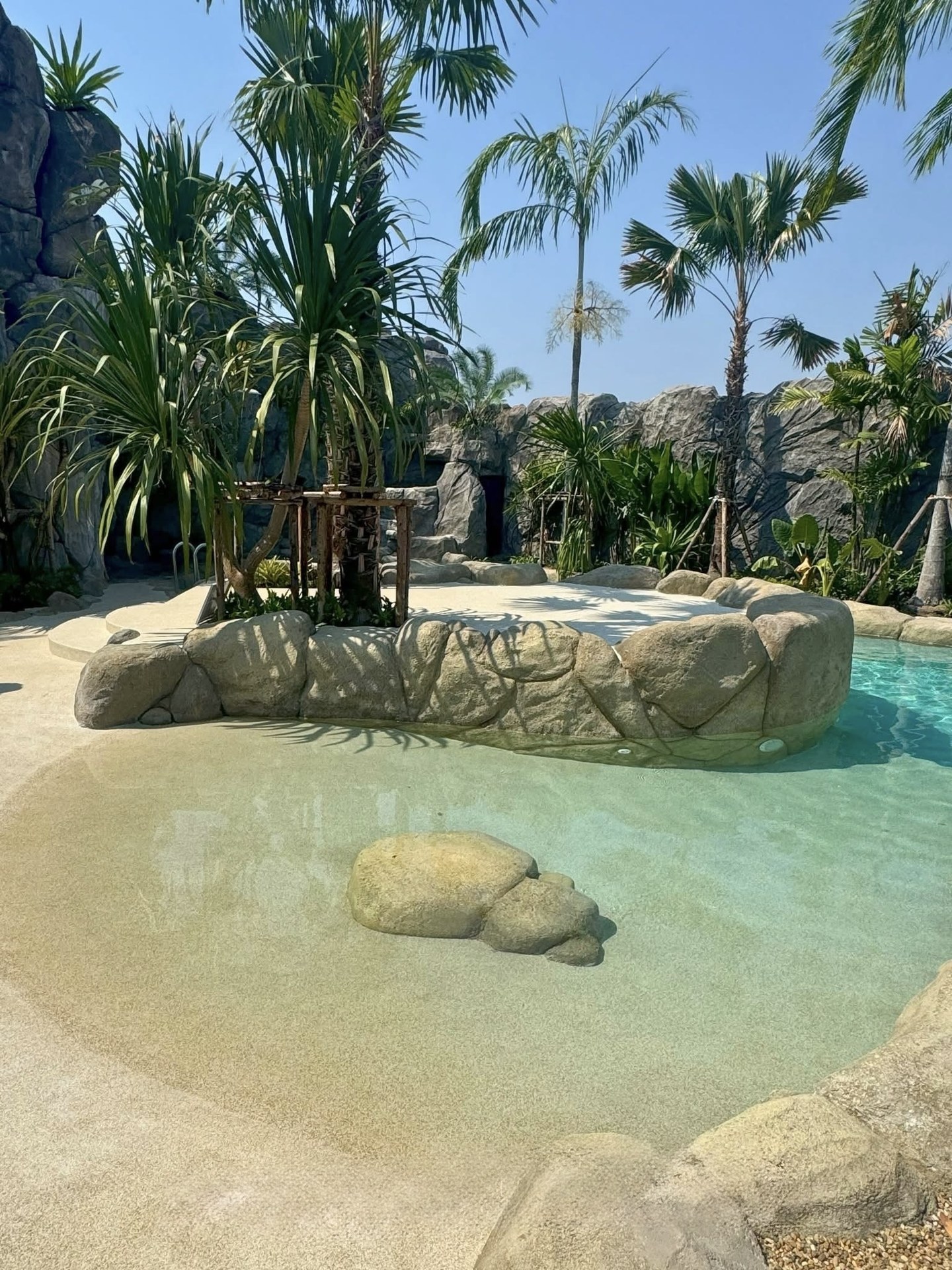 Sandy Beach finish across the terrace and shallow entrance of a private lagoon pool in Hua Hin