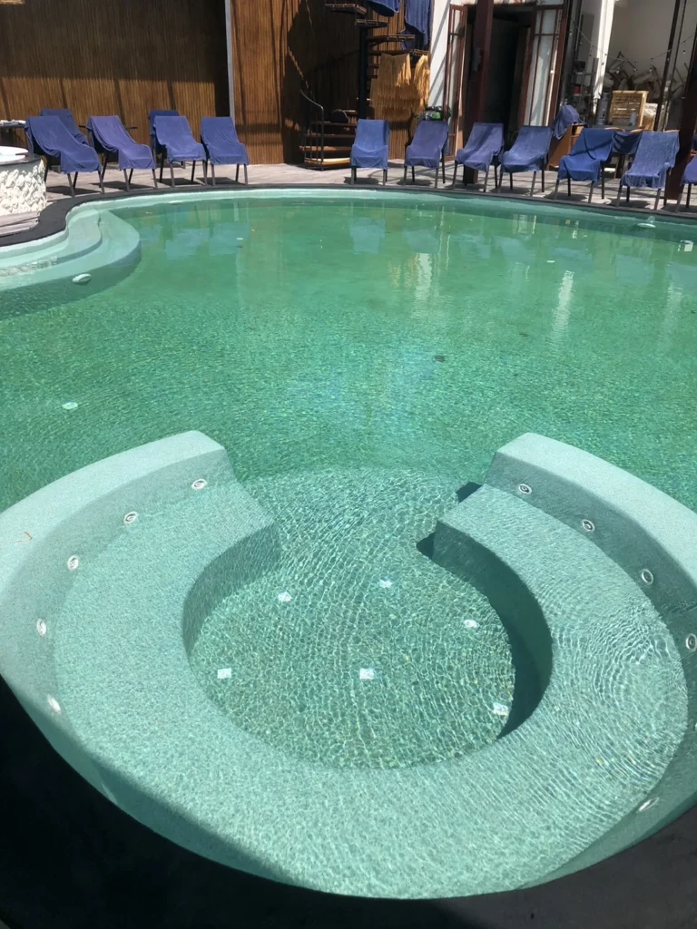 Curved submerged seating in the Irish Green main pool at ZIMA Spa