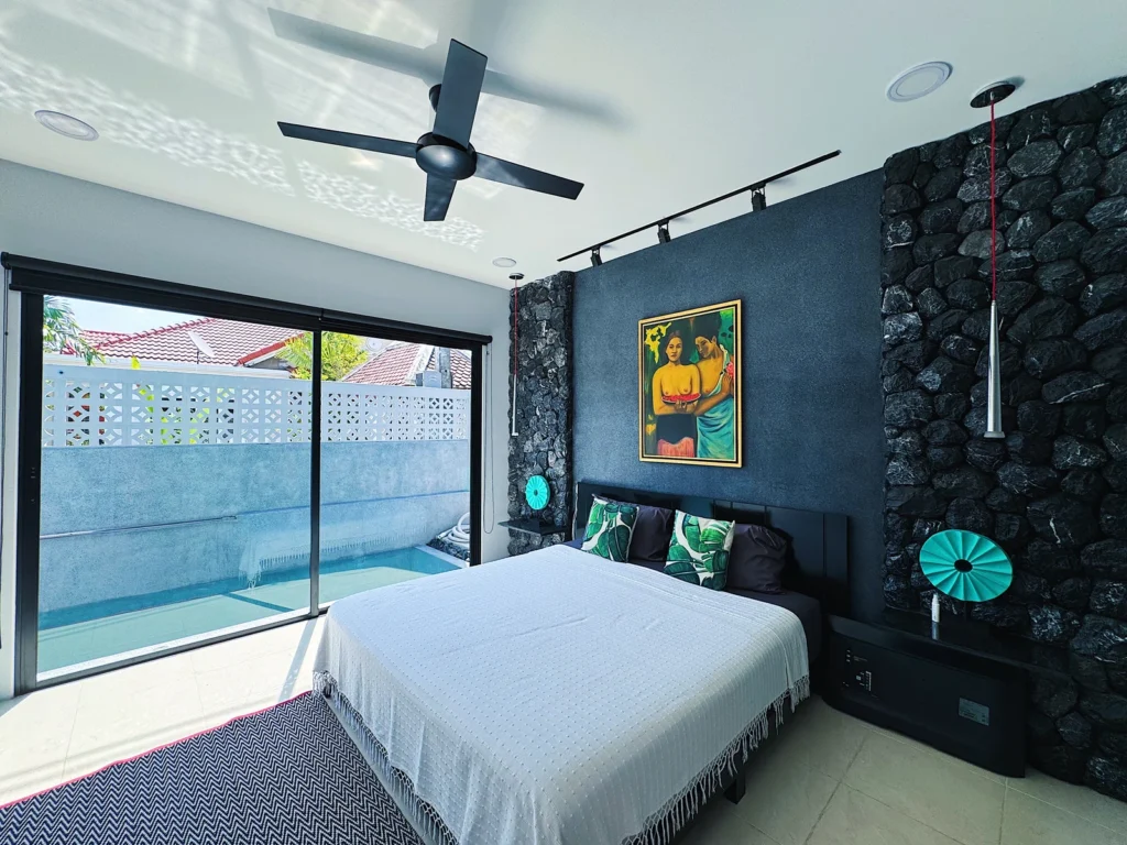 Custom PebbleGlass wall in a bedroom at a private villa in Phuket