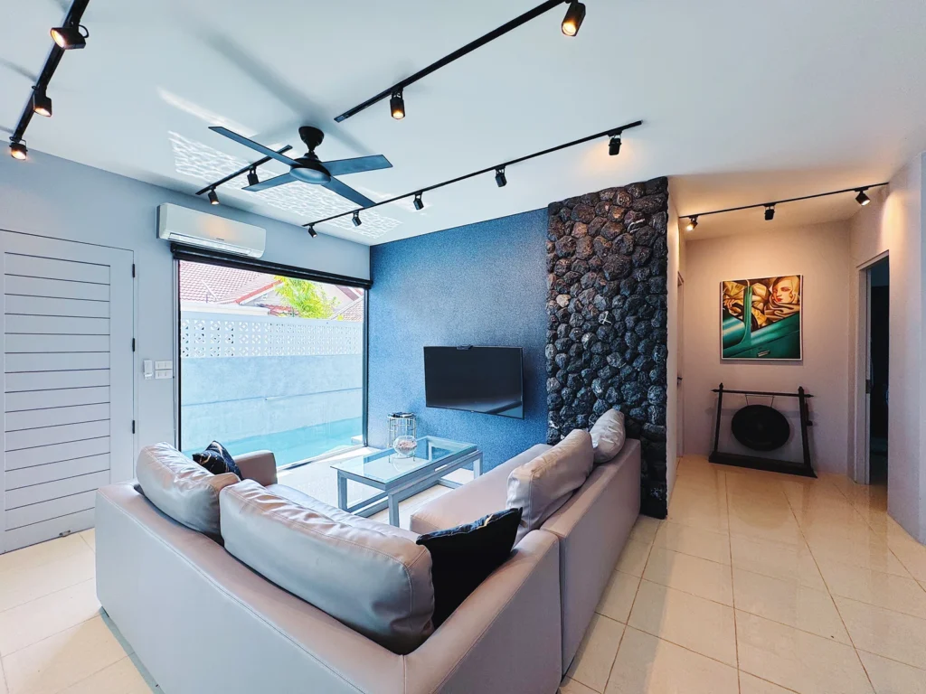 Custom PebbleGlass interior wall and pool view at a private villa in Phuket