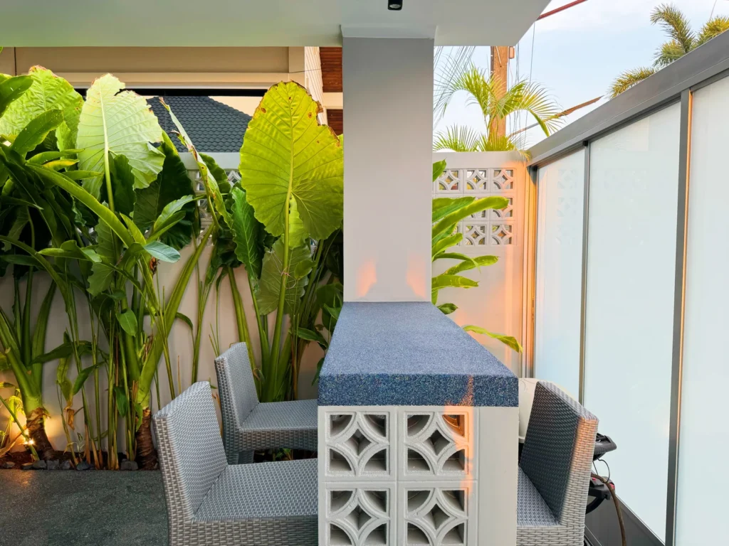 Shaded wall and terrace with custom PebbleGlass at a private villa in Phuket
