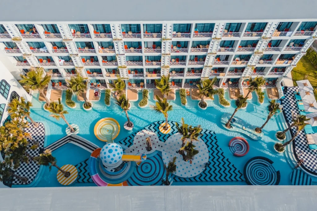 Aerial view of the courtyard pool and colourful islands at Sugar Marina POP - Kata Beach