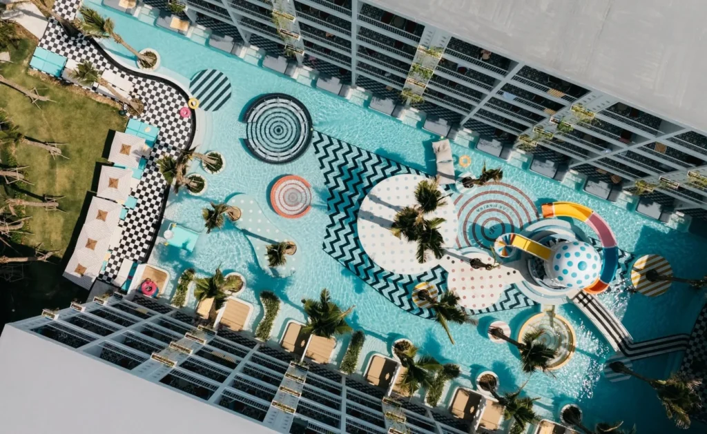 Overhead view of the pool winding around palm islands at Sugar Marina POP - Kata Beach