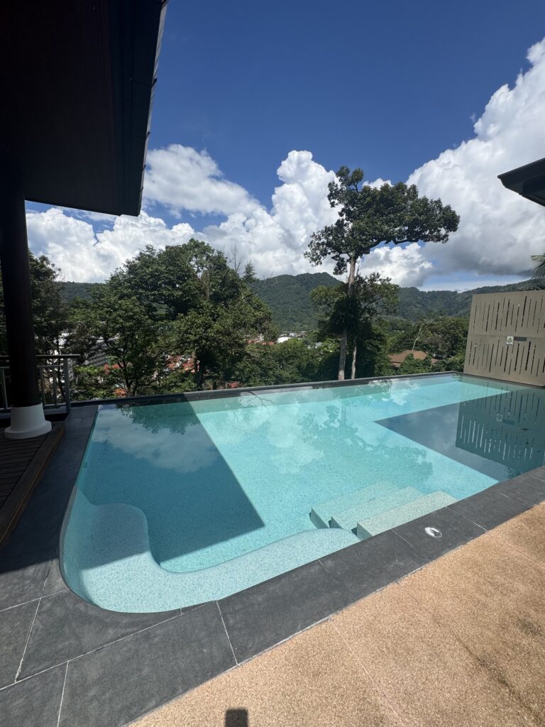 Pool overlooking the green hills at Villa Tantawan, Phuket