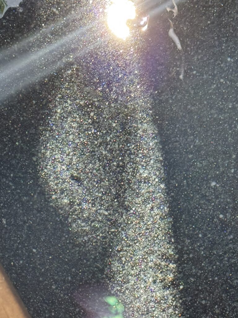 Iridescent aggregate detail in the dark finish at Villa Tantawan